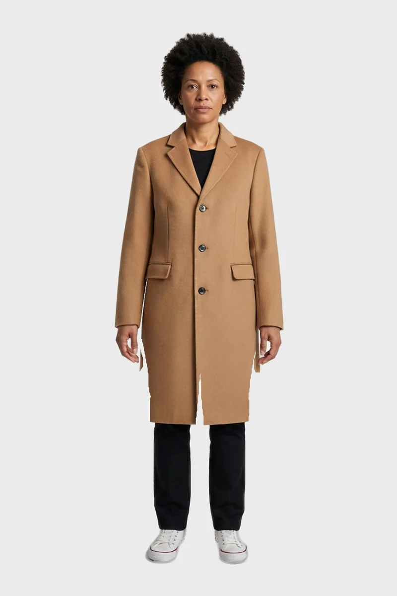 The same model wearing a camel overcoat, tried on in Lapel